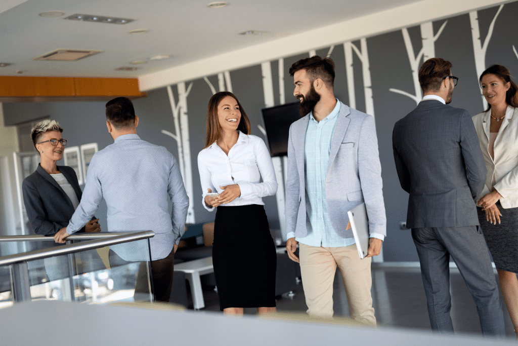 A group of business people talking outside the office